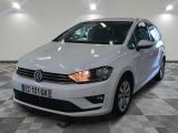 the white volkswagen polo is parked in a room with a checkered floor