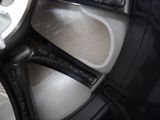 a close up of a car wheel with a black rim