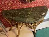a table with a marble top in a room