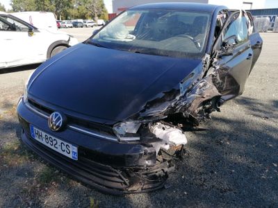 a car that has been badly damaged and is parked in a parking lot