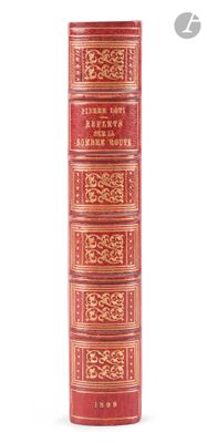 an old red book with gold trimmings on it