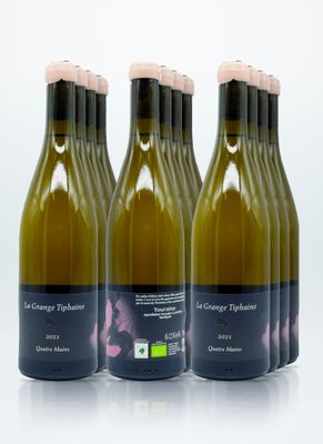 four bottles of wine are lined up on a white surface