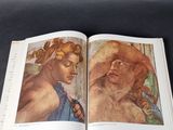 an open book with a painting of a woman and a man