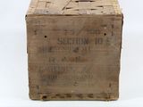 an old wooden crate sitting on top of a white surface