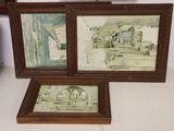 two framed pictures of a man and a woman in a kitchen
