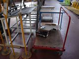 a dolly truck with a box on it in a warehouse