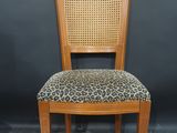 an image of a wooden chair with a leopard print seat