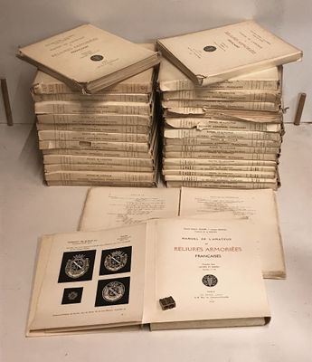 several books stacked on top of each other on a table