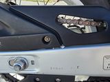 a close up of a motorcycle with a chain attached to it