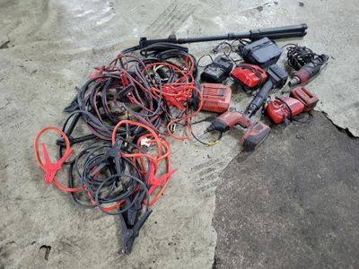 a lot of wires and tools on the ground