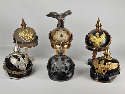 four different types of helmets are displayed on a white surface