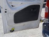 a white van with the door open in a parking lot