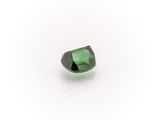 a green tourmaline stone on a white background