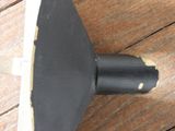a black umbrella that is on a wooden floor
