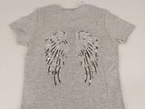 a grey t - shirt with angel wings on the back