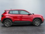 the red chevrolet rav is parked in a parking lot