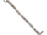 a close up of a silver chain with a key on a white background