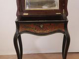 a small table with a mirror on top of it