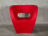 a red chair with a hole in the middle of it