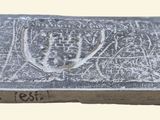an image of a silver plate with a coat of arms on it