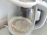 a blender that is sitting on a counter next to a cup of coffee