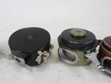 three different types of old cameras on a white surface