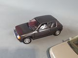 two toy cars that are sitting next to each other