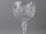 an antique glass wine goblet with a raised stem and a raised stem