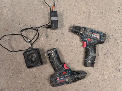 two tools that are laying on the ground together