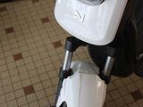 a close up of a motorcycle parked in a room