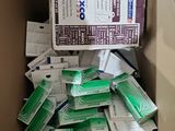 a cardboard box filled with boxes of cigarettes and cigarettes