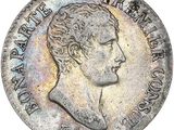 a close up of a coin with a man ' s face on it