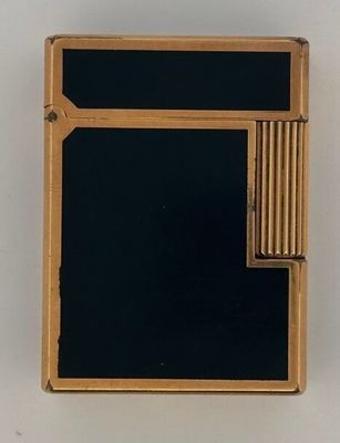 a lighter that is sitting on a white surface