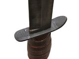 a knife that is sitting on top of a bottle