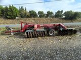 an image of a tractor with a plow attached to it
