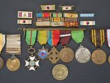 many medals and medals on display on a black surface