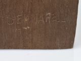 a close up of a piece of wood with writing on it
