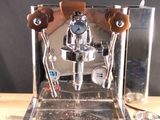 a coffee machine that is sitting on a wooden table
