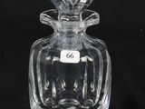 an old fashioned glass perfume bottle with a label on it