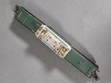 a small model of a green train on a table