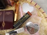 a basket with various cosmetics items on top of it