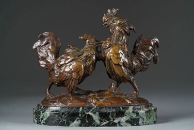 bronze statue of two roosters on a marble base on a gray background