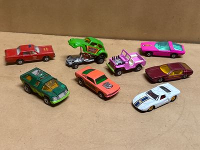 a lot of toy cars that are sitting on a table