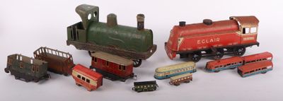 many different types of toy trains on a white surface