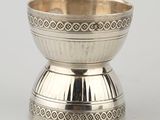 a silver bowl with a decorative design on the rim