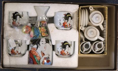 a box that has a set of tea cups and saucers in it