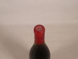 a bottle of wine that is sitting on a table