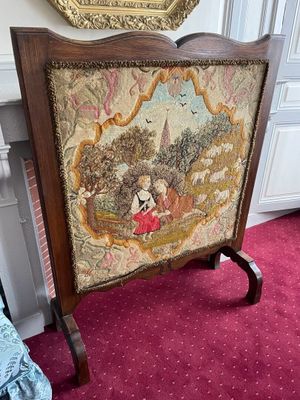 a picture of a painting on a stand in a room
