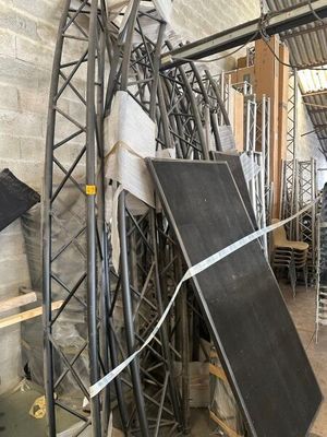 several pieces of metal are stacked on top of each other in a room