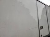 a white truck that is parked on the side of the road